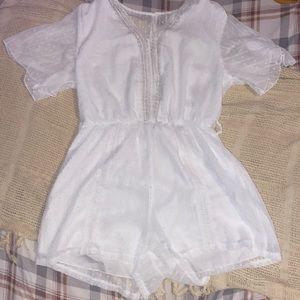 White romper with very cute designs and patterns